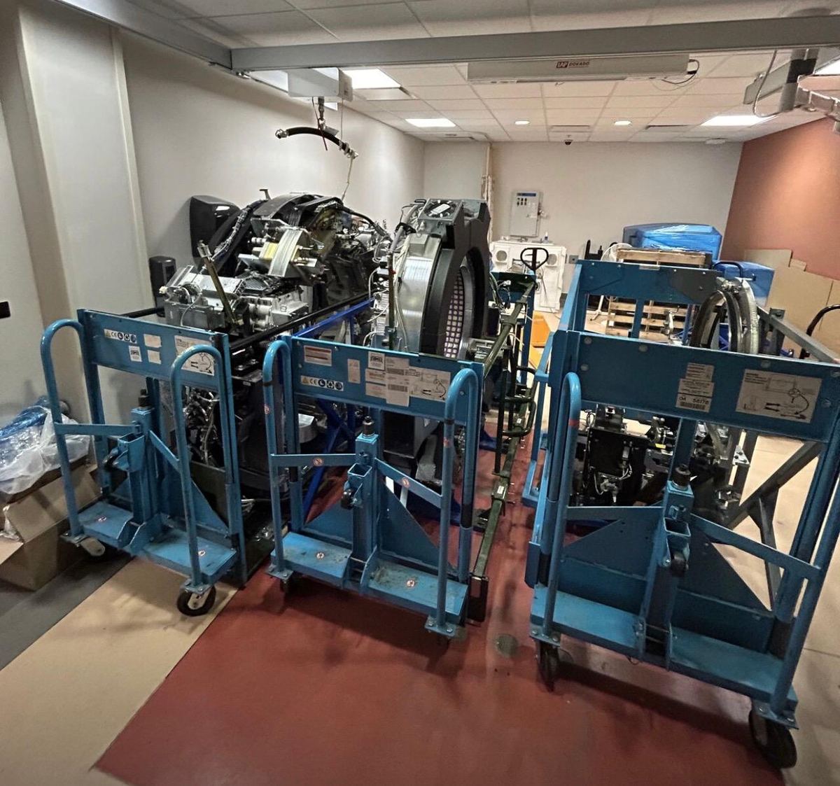 CT scanner broken down into components on transport frames