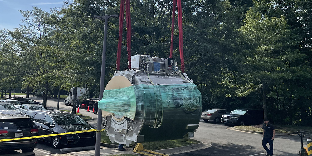 Crane rigging an MRI magnet into position at a healthcare facility